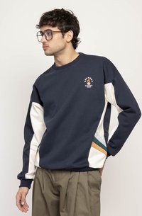 Navy sweatshirt with white, teal, and orange accents; features a round neckline and logo graphic with stars on the chest. Soft texture.