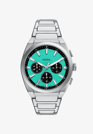 Orologio in acciaio inossidabile argentato con un quadrante testurizzato turchese, sottodial cronografici neri, marcatori delle ore argentati e un design della bracciale elegante.