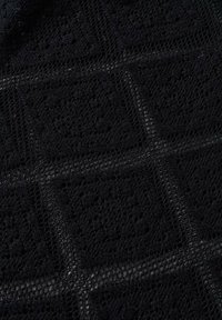 Black lace fabric featuring an intricate, textured pattern with square motifs and open weaves, creating a delicate and breathable surface.