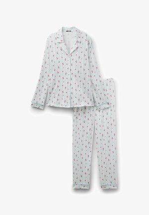 Ensemble de pyjama composé d'un haut à rayures bleu clair à manches longues avec boutons et col, et d'un pantalon, imprimé de petites fleurs roses, posé à plat sur un fond blanc.