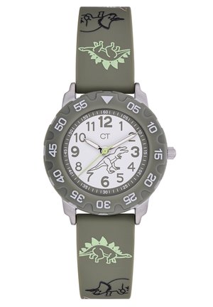 Montre avec un bracelet en silicone vert, un cadran blanc, des marqueurs numériques et un graphique de dinosaure. Elle possède une lunette grise et des motifs de dinosaure distinctifs.