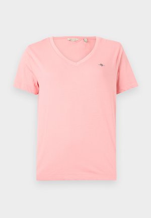 Pink V-neck T-shirt made of soft cotton, featuring short sleeves and a small logo on the left chest. Simple, solid color design.
