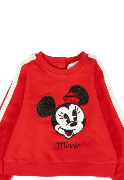 Rode kindertrui met witte strepen op de mouwen en een pailletten Minnie Mouse gezicht met een rode hoed aan de voorkant.