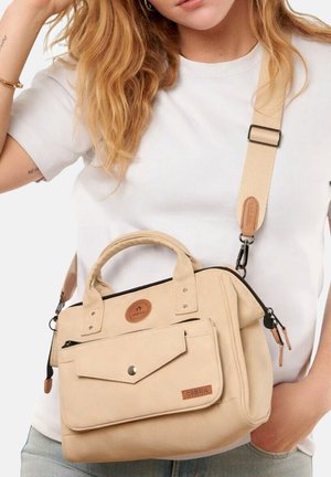 Beige fabric handbag with dual handles, detachable shoulder strap, front flap pocket, and leather accents. Features a zipper closure.