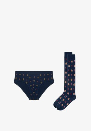 Navy blue briefs and knee-high socks with gingerbread men and candy cane patterns, holiday-themed underwear set.