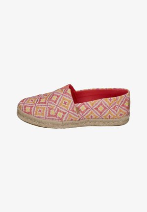 Patterned slip-on shoe with pink, orange, and yellow geometric designs, featuring a jute rope sole and a bright red interior lining.
