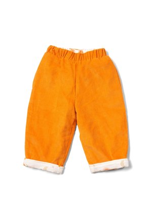 Orange corduroy pants with an elastic waistband. Cuffed hem featuring a patterned border with celestial designs. Soft texture, relaxed fit.