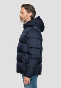 Doudoune bleu marine avec une capuche, présentant des sections matelassées, deux poches zippées et une texture lisse et brillante.