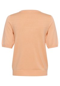 Pull en maille à manches courtes couleur pêche, tissu doux, col rond, poignets et ourlet côtelés, texture lisse, design simple.