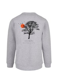 Gray sweatshirt featuring a black silhouette of a tree, an orange sun, and birds, with the text "ESCAP3" below the design.