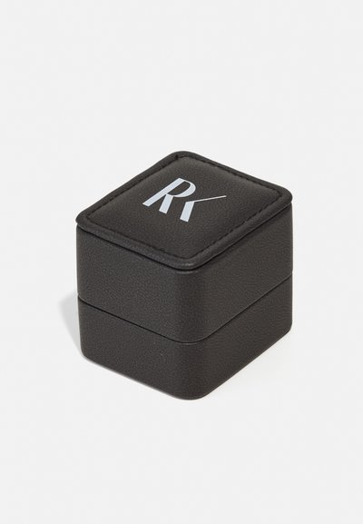Black leatherette jewelry box with a textured surface, featuring a gray "RK" logo on the lid and a square design.