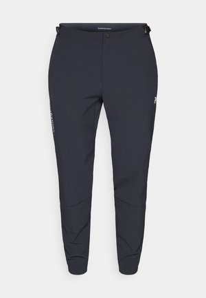 Navy performance pants with a straight leg design, featuring a button closure, adjustable waistband, and subtle logo detail on the side.