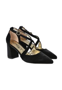 Zapatos de tacón alto de ante negro con punta afilada, con correas entrelazadas y una plantilla con detalles en dorado. Diseño de tacón cuadrado.