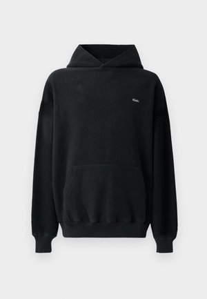 Svart huvtröja tillverkad av mjukt, texturerat tyg. Har en känguruficka, framsidan med logotyp och ribbade ärmslut och nederkant. Oversized design.