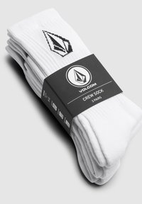 Drei Paar weiße Crew-Socken aus Baumwolle mit geripptem Material und schwarzem Volcom-Logo auf einem zentralen schwarzen Band.