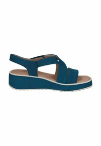 Tyrkysové klínové sandály s křížovými popruhy, uzavřenou patou a texturovanou platformou. Hladký svrchní materiál a minimální bílý akcent na podrážce.