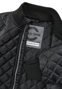 Black quilted bomber jacket with a ribbed collar and cuffs, featuring a silver zipper and a label displaying the brand and size.