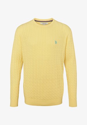 Kollane soonikootedega svasnogiga, millel on ribaga mansetid ja serv, ning rinnal väike türkiissinine logo.