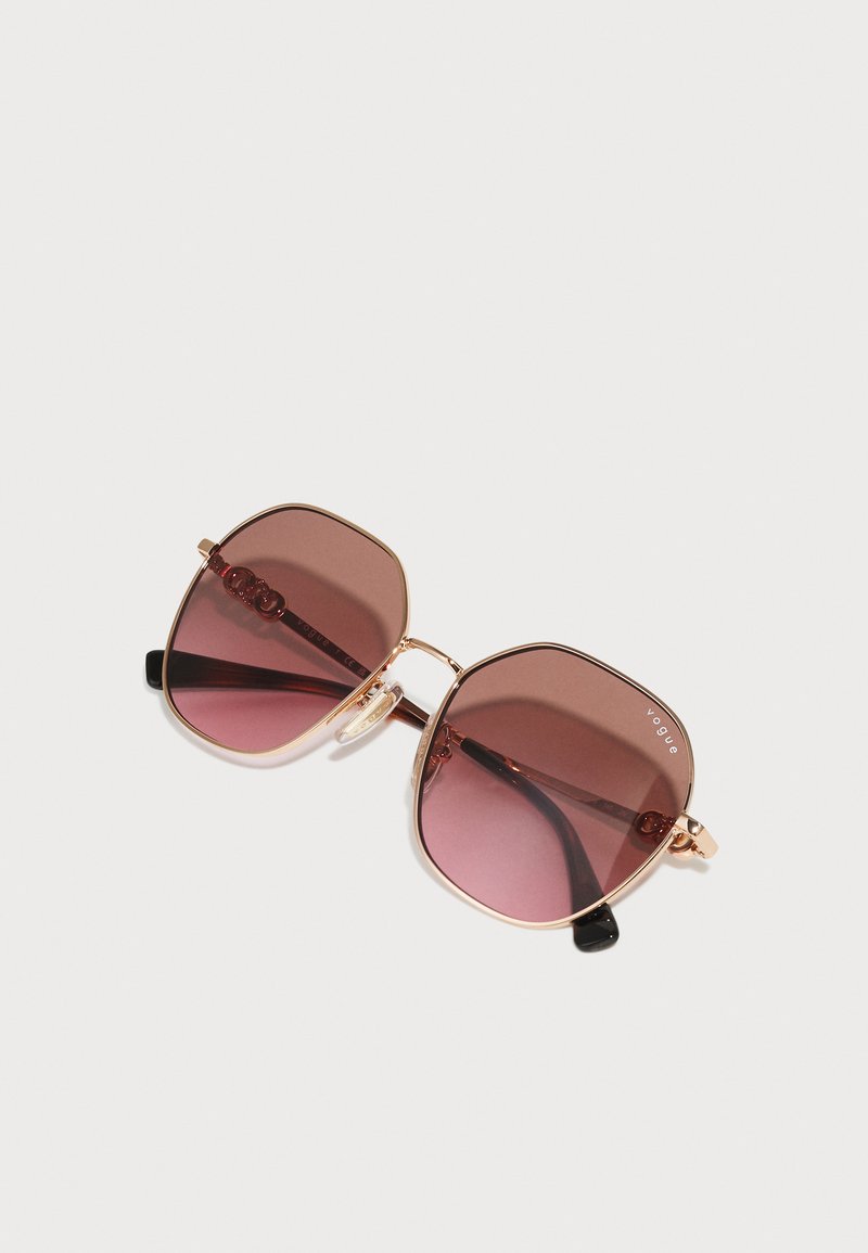 Vogue - Occhiali da sole polarizzati irregolari colore oro rosa con lenti viola