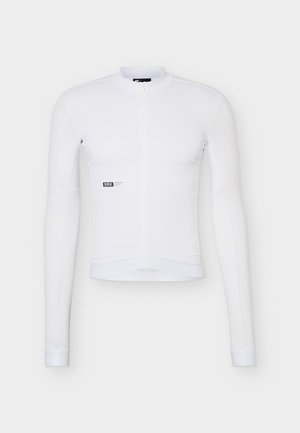 Maillot de cyclisme blanc à manches longues avec fermeture éclair complète à l'avant et petit logo noir « SRK » sur le côté gauche.