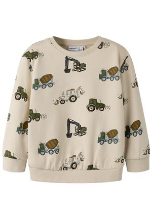 Sweat-shirt beige à manches longues pour enfants avec des imprimés verts de tracteurs, d'excavatrices et de camions malaxeurs à ciment dans un motif répétitif.