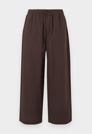 Løse, mørkebrune bukser med elastisk talje og snor, lige, brede ben, forlommer, uden synlige logoer eller mønstre.