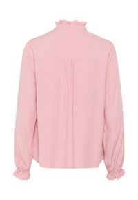 Pink long-sleeve blouse with a ruffled collar and cuffs, featuring a relaxed fit and gathered detailing across the back.