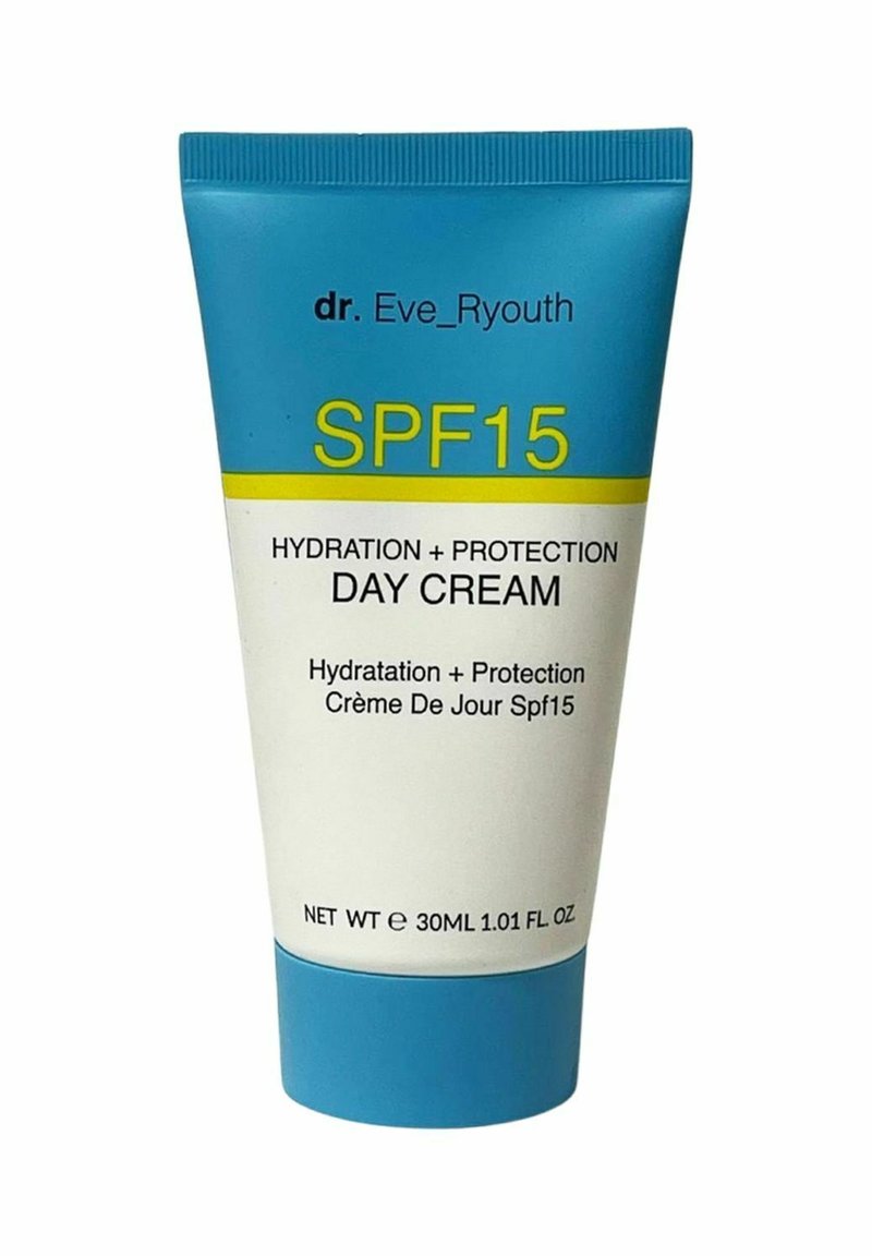 Biała tubka z turkusową nakrętką, oznaczona napisem 'KREM DZIENNY SPF15' w żółtym i czarnym kolorze, wskazującym na nawilżenie i ochronę. Rozmiar 30ML.