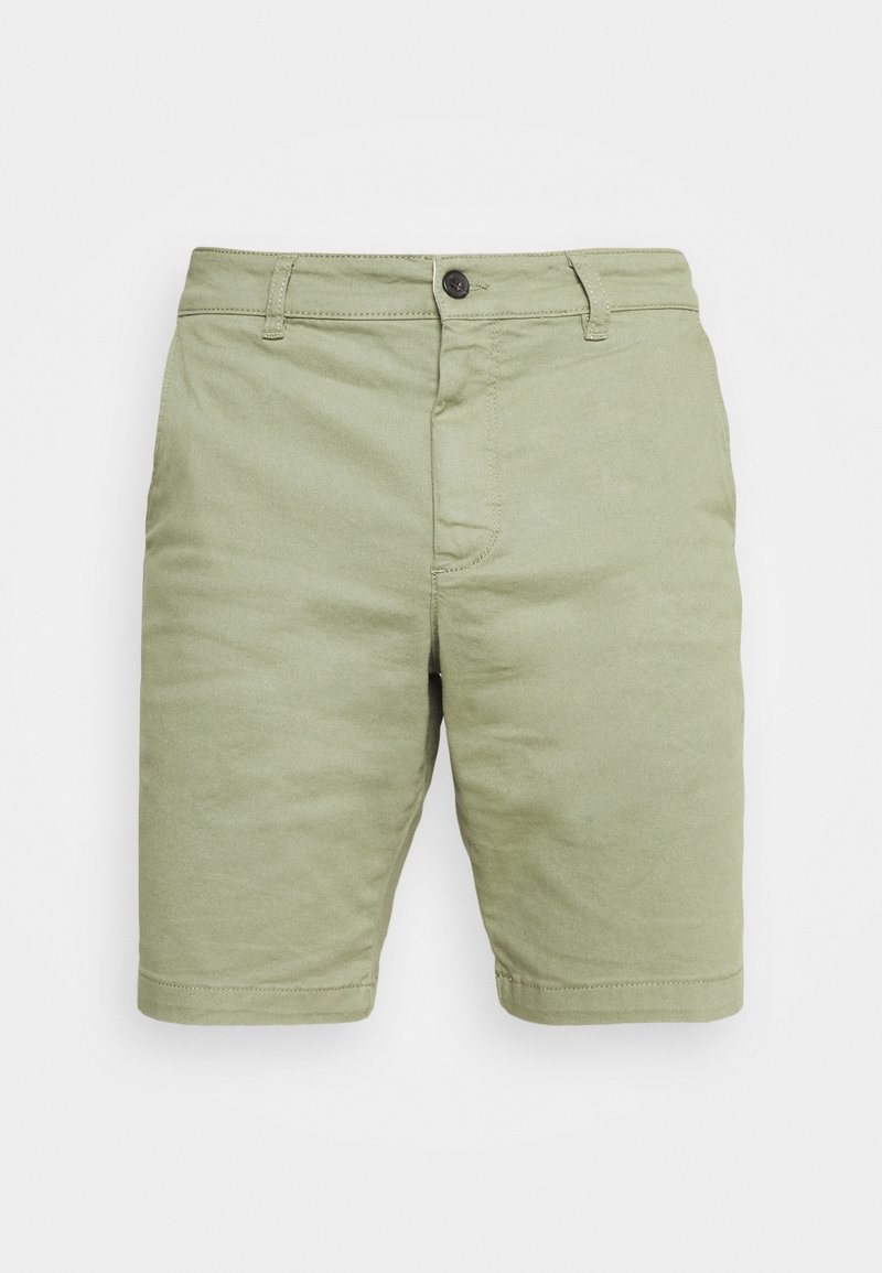 Shorts vert clair en coton, avec fermeture à bouton, poches avant et coupe droite. Texture lisse, sans motifs.