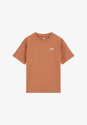 T-shirt a maniche corte color ruggine con tessuto a costine, collo rotondo e piccola toppa con logo "Puerto Montana" sul petto a sinistra.