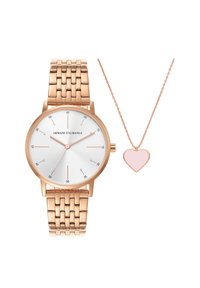 Rose gold watch with a silver dial, metal link bracelet, and pink accented hands, paired with a delicate rose gold chain necklace featuring a pink heart pendant.