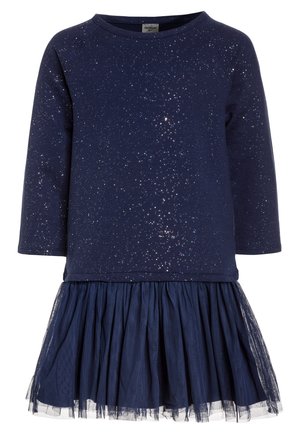 Marineblaues langärmeliges Kleid mit glitzernden, sternähnlichen Details oben und einem plissierten Tüllrock unten.
