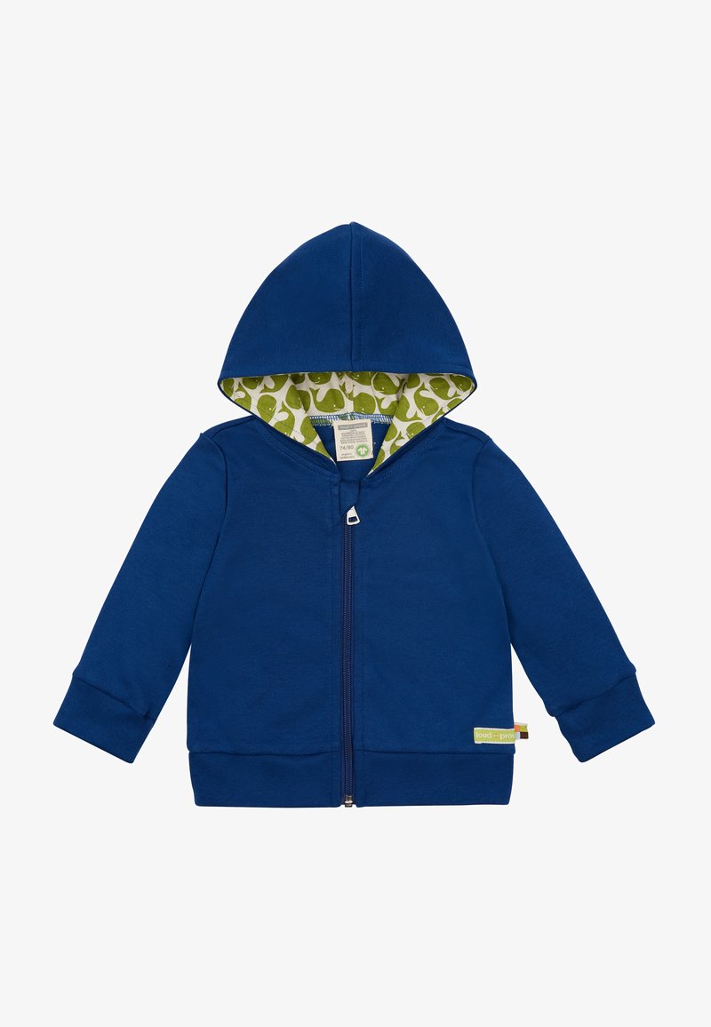 Felpa blu con zip e fodera verde a motivo, con piccoli balenotteri bianchi, maniche lunghe e polsini a costine. Etichetta visibile sul bordo inferiore.