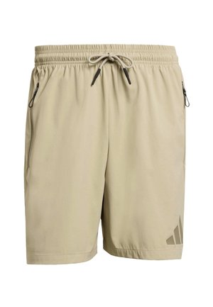 Beige atletiske shorts med elastisk talje, snøre og to sidelommer med lynlås. Har et diskret logo på venstre ben.