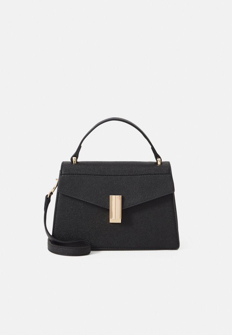Sac à main en cuir noir texturé avec une anse supérieure, une bandoulière amovible et un fermoir rectangulaire central doré.