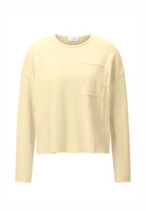 Beiges Sweatshirt mit langen Ärmeln, rohen Kanten und einer ausgefransten Brusttasche, mit Rundhalsausschnitt und lockerer Passform.