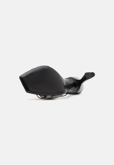 Black shoe with a pointed toe and low heel, featuring a silver studded accent along the back and a smooth leather finish.