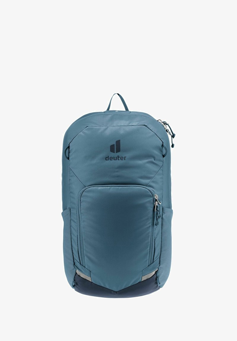 Türkiser Nylon-Rucksack mit einer Front-Reißverschlusstasche, seitlicher Netztasche, Logodetails und reflektierenden Akzenten am Boden. Verfügt über verstellbare Schultergurte.