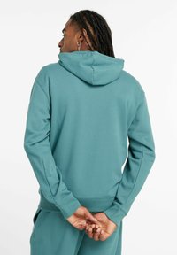 New Balance SPORT ESSENTIALS FRENCH TERRY - Hoodie - green