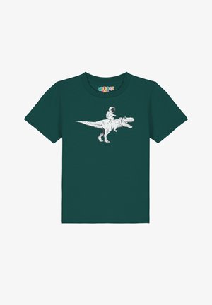 Türkise Baumwoll-T-Shirt mit einem weißen Grafikmotiv eines Astronauten, der auf einem T-Rex reitet. Das Shirt hat kurze Ärmel und einen Rundhalsausschnitt.