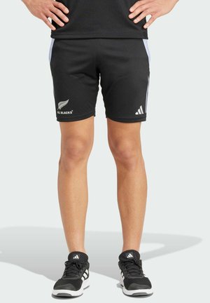 Black athletic shorts made of lightweight fabric, featuring a fitted design, contrasting white side stripes, and "ALL BLACKS" logo on left leg.