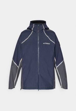 Navy waterproof jacket with grey accents, adjustable hood, full front zipper, and logo on the chest. Features sleek, sporty design.