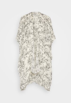 Lätt kimono i krämfärgad med svarta blommönster. Har en öppen framsida, lös passform och korta ärmar. Mjuk, strukturerad tyg.