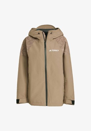 Beige waterproof jacket with a hood, zip closure, and textured shoulder accents. Features adjustable cuffs and logo on the chest.