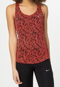 Nike Performance Sports T-shirts - red