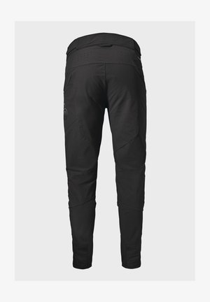 Black, slim-fit pants with a textured finish, featuring angled seams, perforations at the waistband, and subtle logo detail on the side.