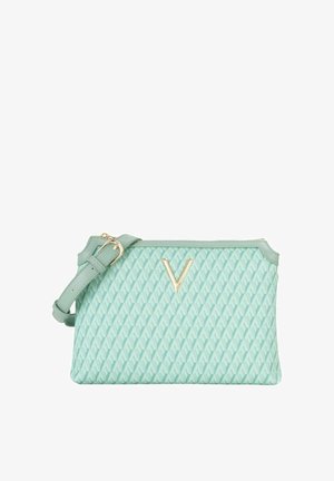 Sac à main vert menthe clair avec tissu texturé, présentant un motif géométrique et des ferrures dorées. Sangle réglable pour un transport polyvalent.