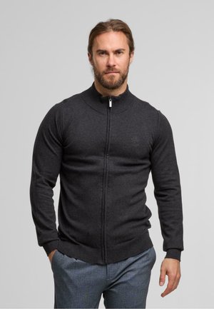 Dark gray zip-up sweater with a high collar, ribbed cuffs, and hem. Made from a smooth knitted fabric, featuring a subtle logo on the chest.