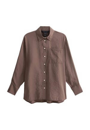 Bruine overhemd met knopen van textuurstof, met een kraag, lange mouwen en een borstzak. Kleine, ronde knopen door het hele shirt.