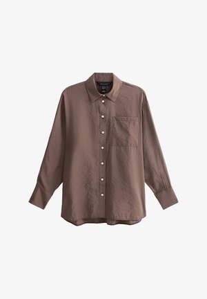 Chemise marron à boutons, en tissu texturé, avec un col, des manches longues et une poche de poitrine. Petits boutons ronds sur toute la surface.